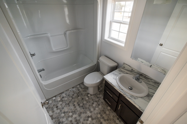 Bathroom with shower, toilet, and sink