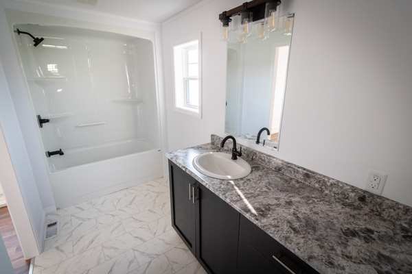 Bathroom with shower, toilet, and sink